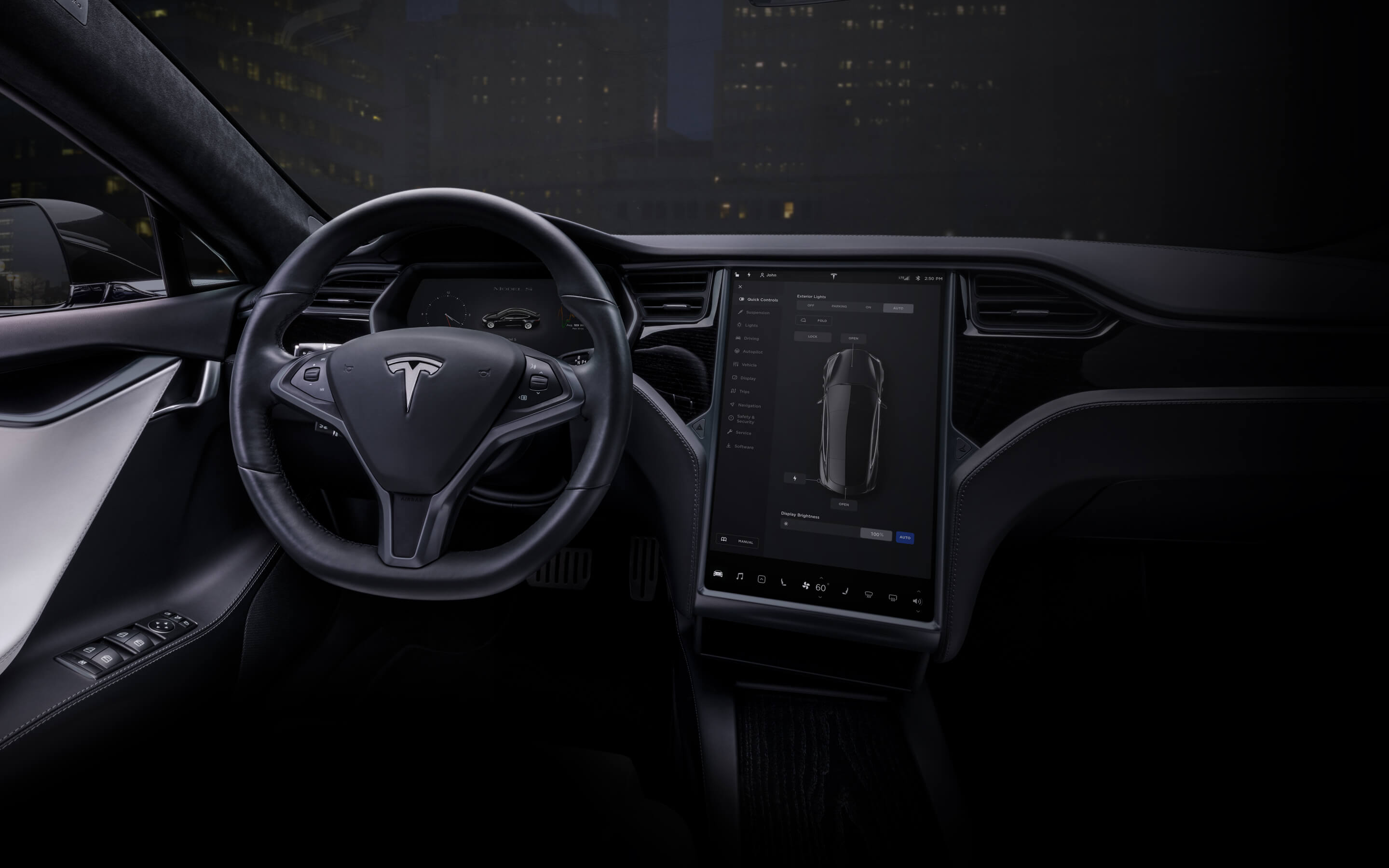 Black Model S interior with 17" touchscreen and steering wheel